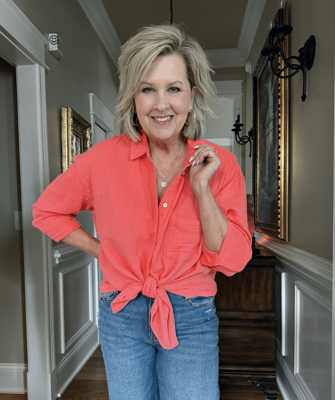 Tania Stephens is wearing a coral gauze shirt from Walmart